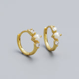 Gold hoop earrings with pearls and small crystals 